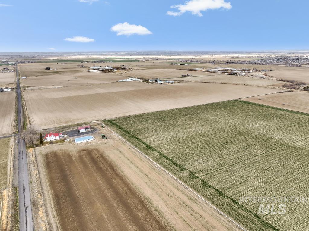 3900 North (52 /- Acres) Filer, ID 83328 - Photo 16 of 29 Aerial view of sparsely populated area with rows of crops