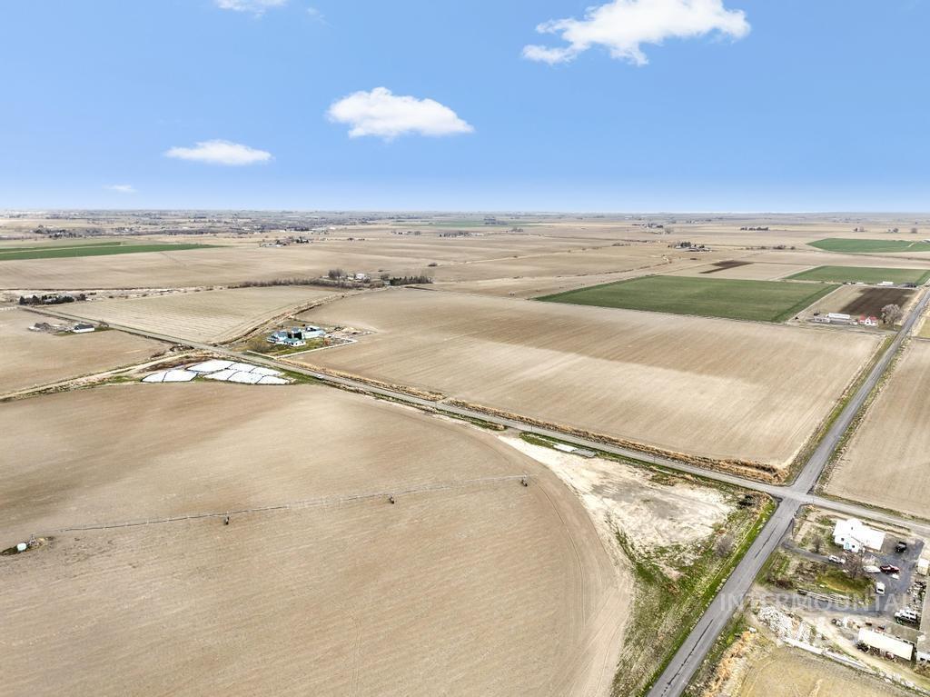 3900 North (52 /- Acres) Filer, ID 83328 - Photo 23 of 29 Overview of rural landscape with rows of crops