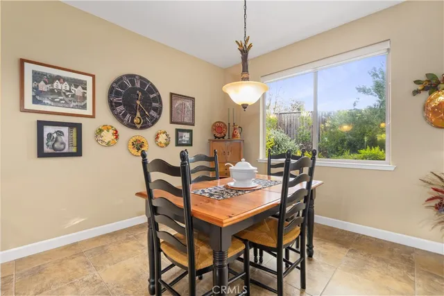 a large kitchen with a table and chairs in it