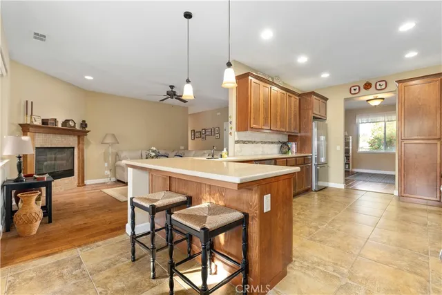 a kitchen with stainless steel appliances granite countertop a refrigerator and a sink