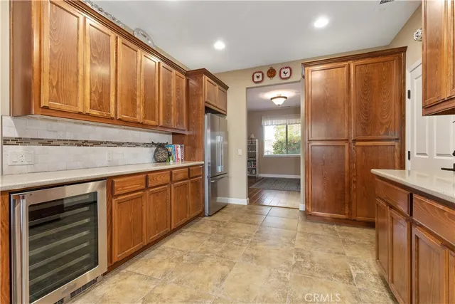 a kitchen with cabinets and window