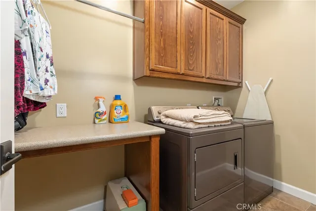 a bedroom with a bed chair and window