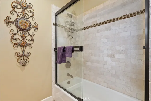 a bedroom with a bed chair and a window