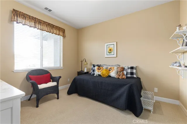 a bedroom with a bed and cabinets