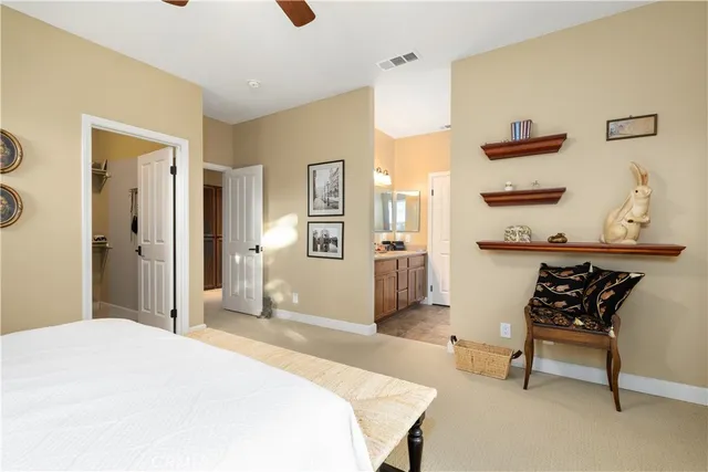 a bathroom with a double vanity sink a mirror and a shower