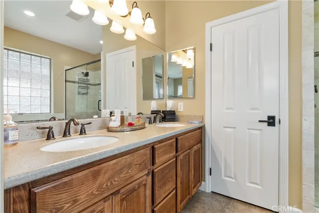 a bathroom with a tub shower and window