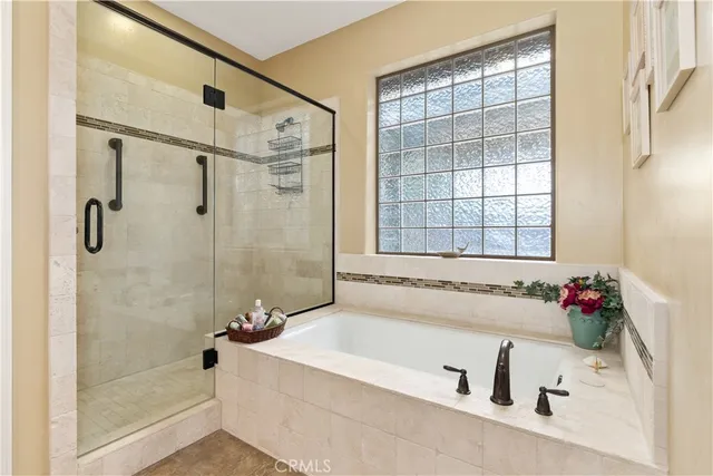 a living room with furniture and potted plant