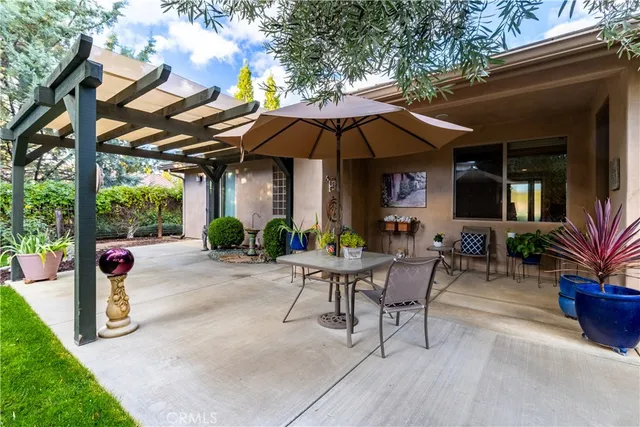 a view of a garden with a bench in patio