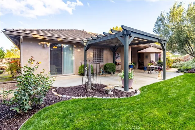 a view of a backyard with large trees