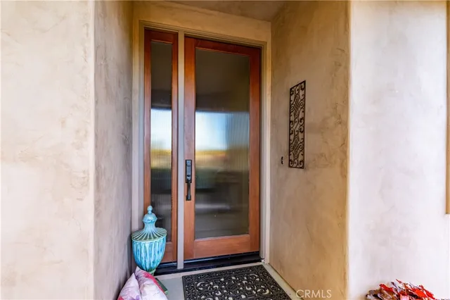 a view of an entryway with wooden floor