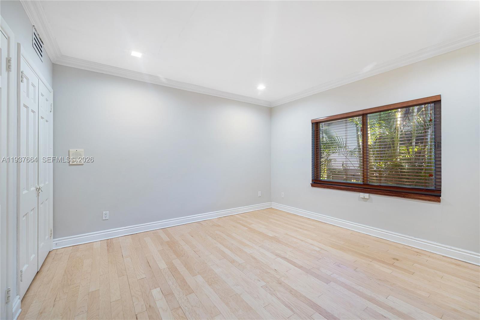 1375 North Biscayne Point Road Miami Beach, FL 33141 - Photo 16 of 40 a view of an empty room with a window