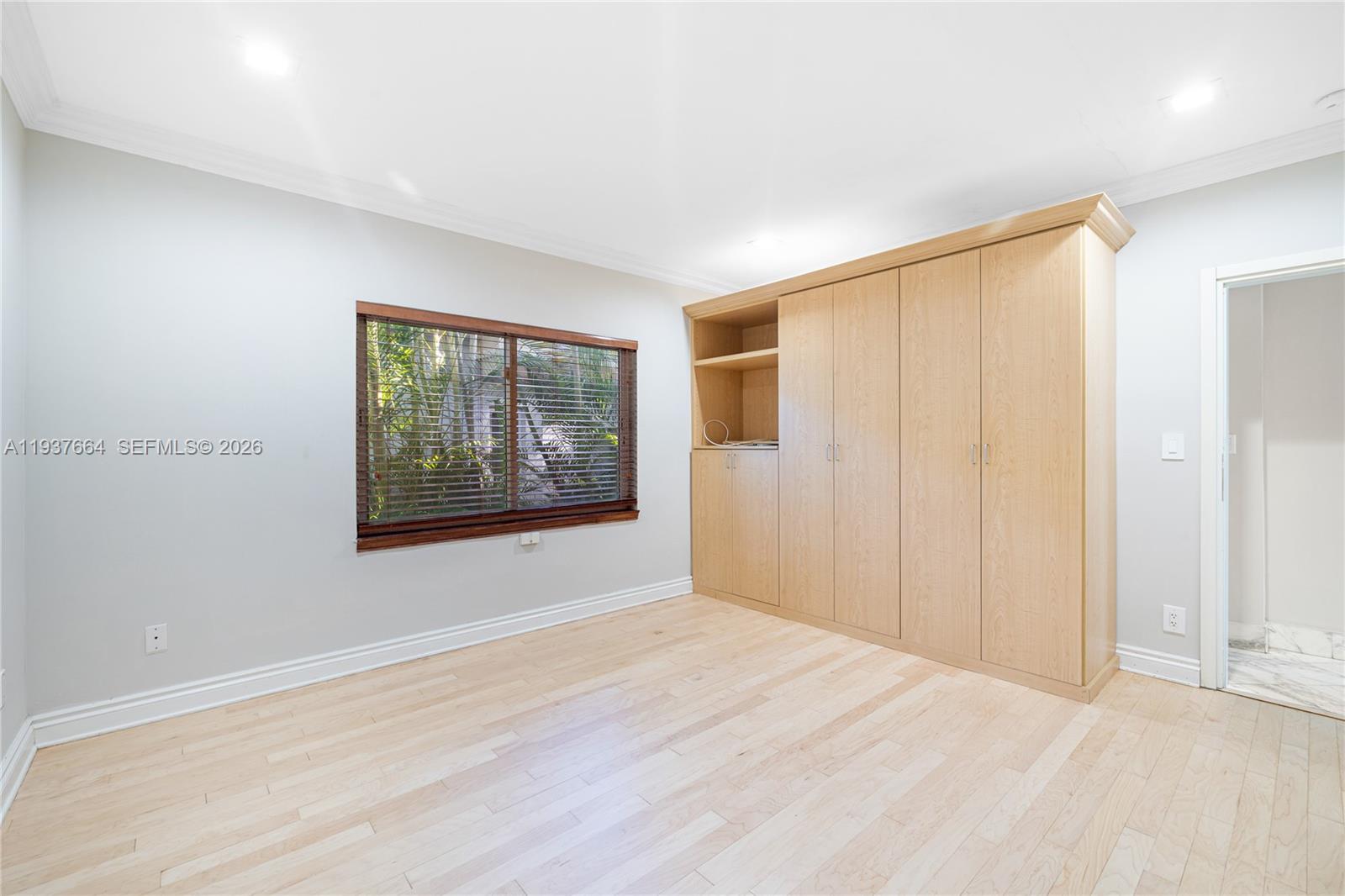 1375 North Biscayne Point Road Miami Beach, FL 33141 - Photo 17 of 40 a view of an empty room with a window