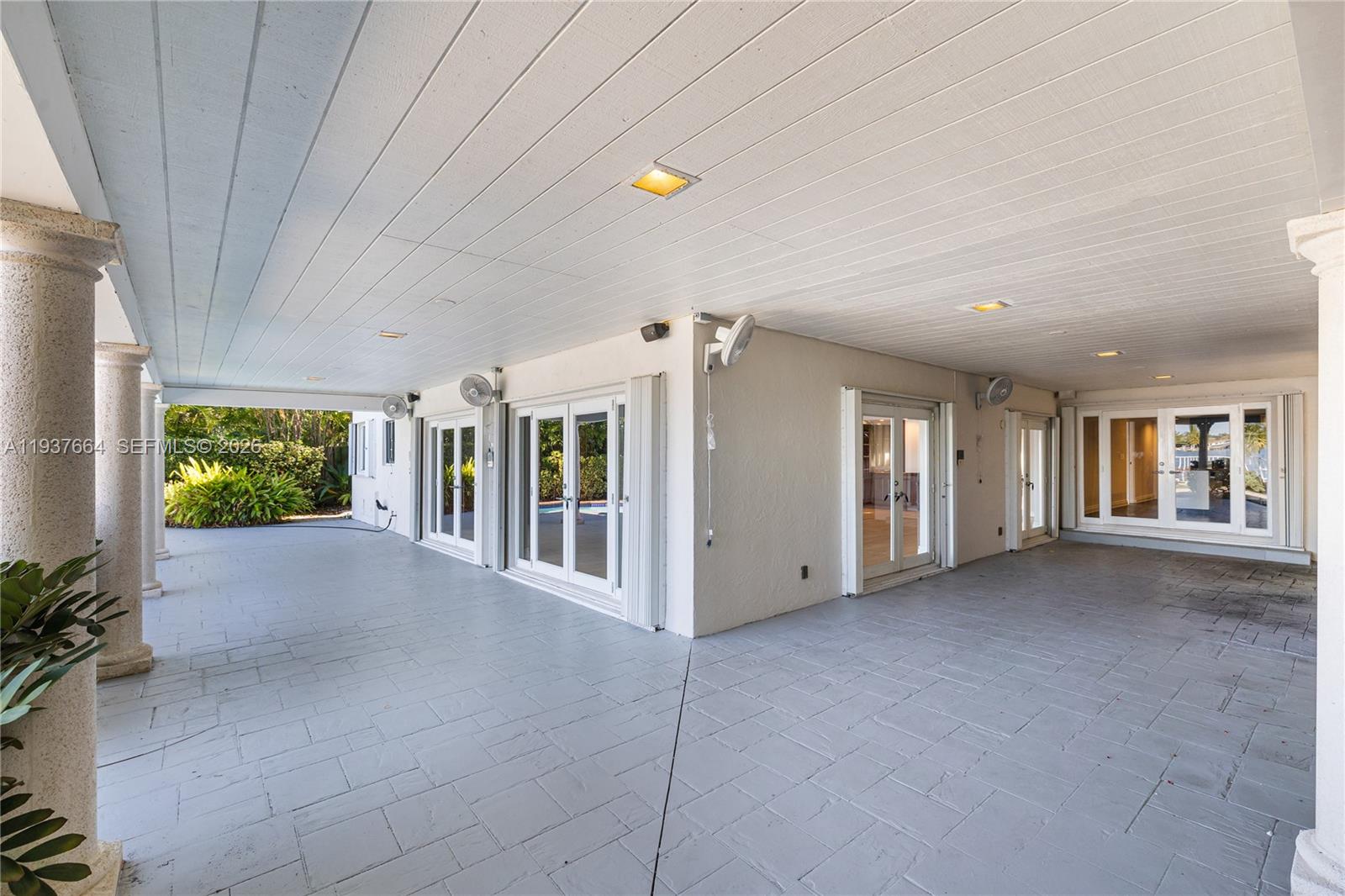 1375 North Biscayne Point Road Miami Beach, FL 33141 - Photo 24 of 40 a view of a house with porch and garden