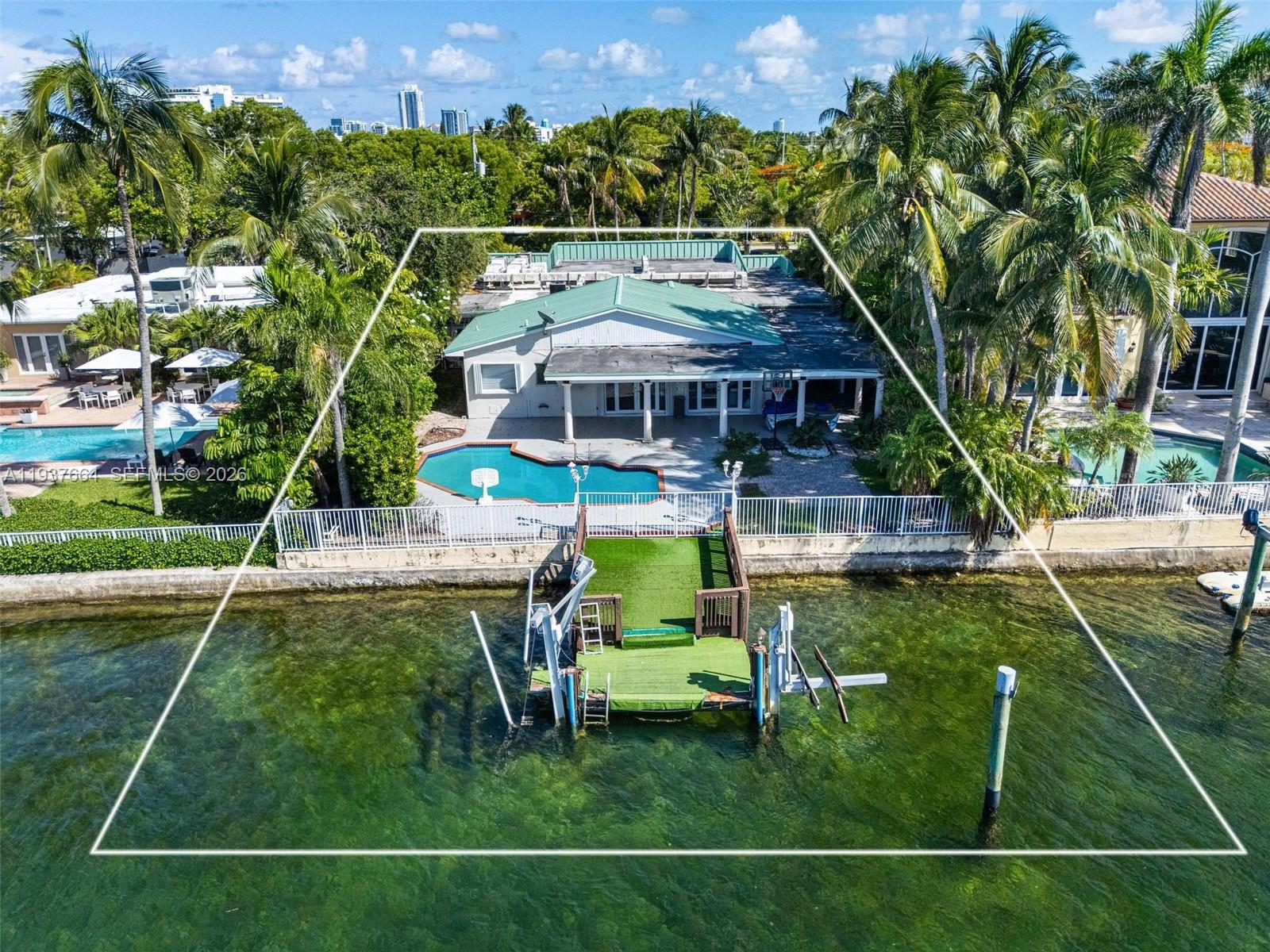 1375 North Biscayne Point Road Miami Beach, FL 33141 - Photo 38 of 40 a view of a house with a big yard