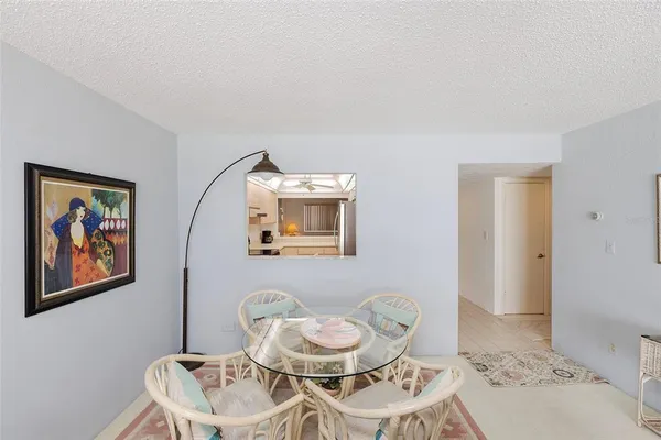 a dining room with a table and chairs