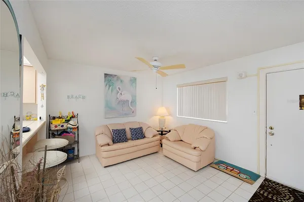 a living room with furniture and a window