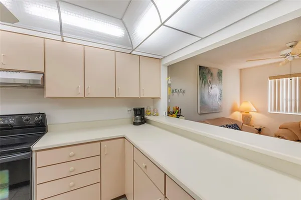 a kitchen with a sink and cabinets