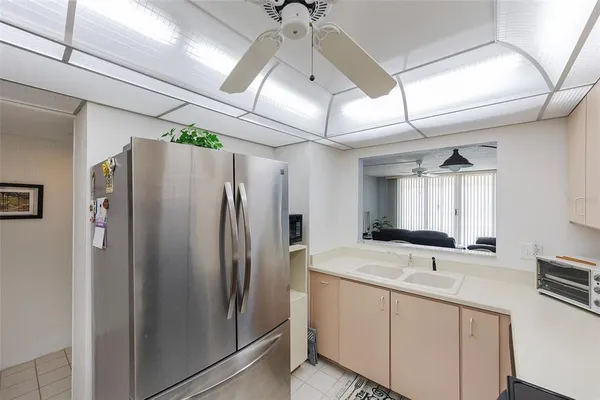 a kitchen with stainless steel appliances a sink and a refrigerator