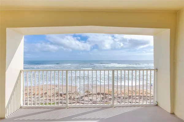 a view of a ocean from a balcony