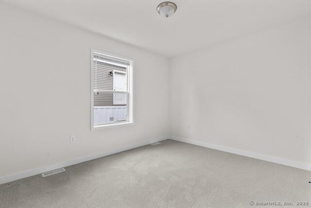 55 Sugar Street, Unit 33 Newtown, CT 06470 - Photo 12 of 17 an empty room with a window