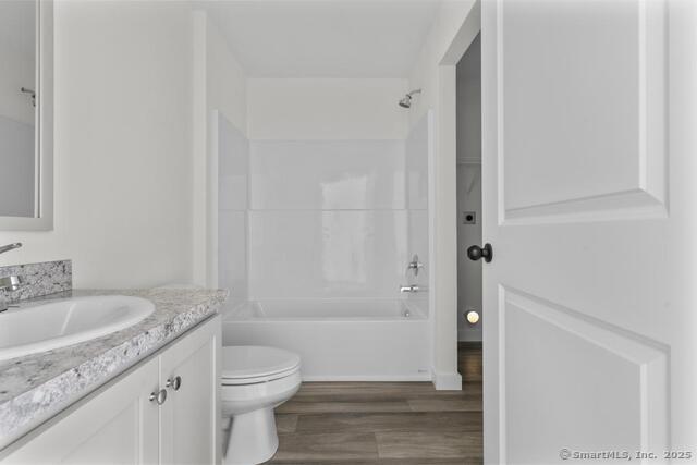 55 Sugar Street, Unit 33 Newtown, CT 06470 - Photo 7 of 17 a bathroom with a granite countertop sink toilet and shower