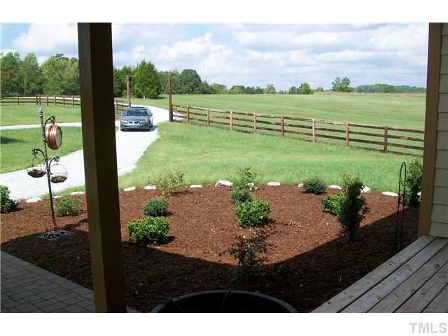 6015 Laws Farm Road Rougemont, NC 27572 - Photo 3 of 25 a view of a lake with a floor to ceiling yard next to a yard