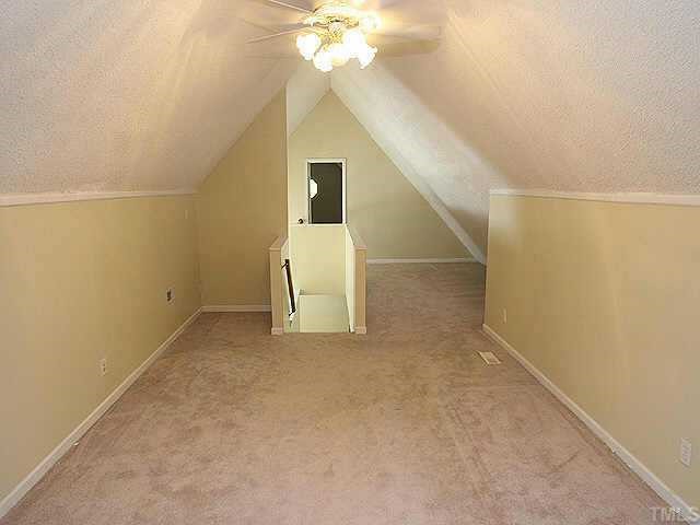 7104 Blalock Road Bahama, NC 27503 - Photo 7 of 8 a view of a livingroom with a chandelier