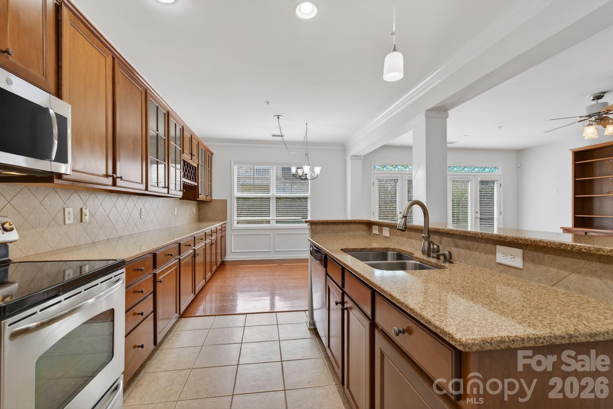 114 Inlet Point Drive Tega Cay, SC 29708 - Photo 12 of 40 a kitchen with stainless steel appliances granite countertop a sink and a stove