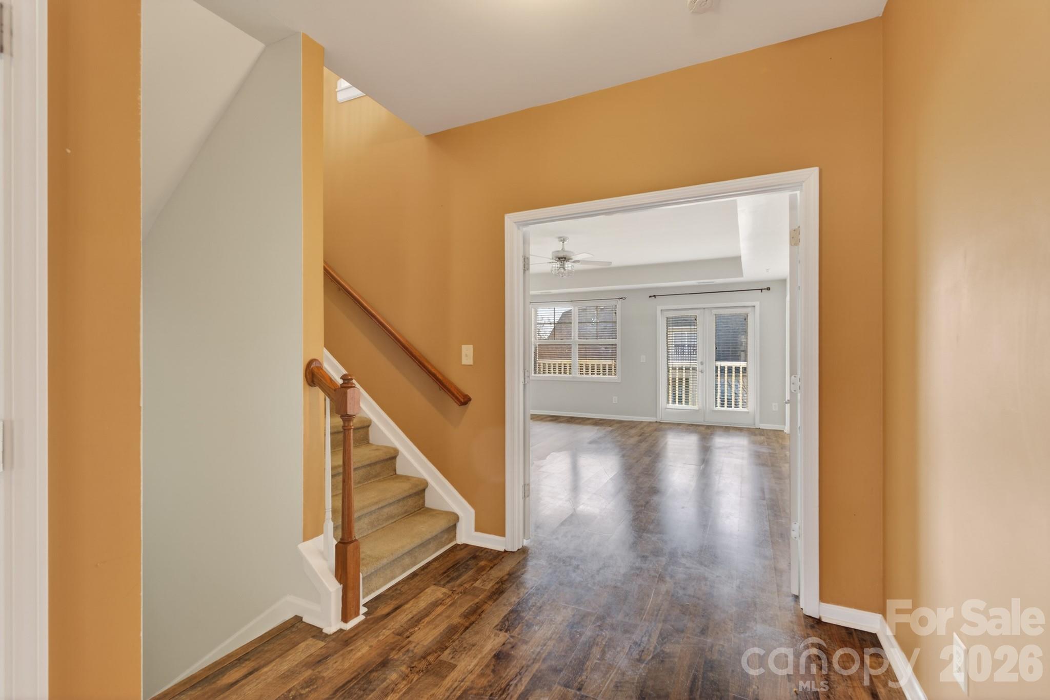 114 Inlet Point Drive Tega Cay, SC 29708 - Photo 14 of 40 a view of a hallway with wooden floor and staircase