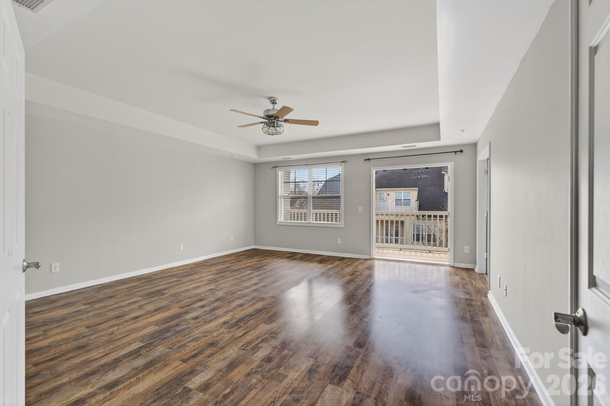114 Inlet Point Drive Tega Cay, SC 29708 - Photo 16 of 40 a view of an empty room with wooden floor and a window