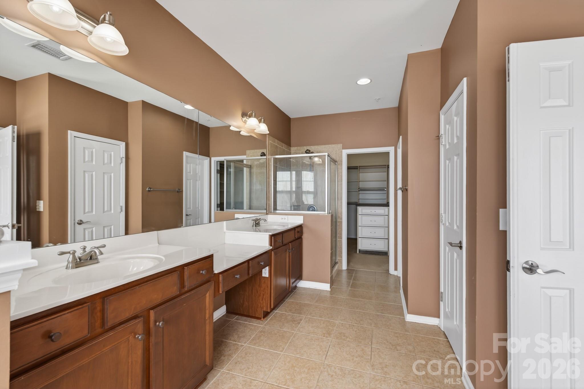 114 Inlet Point Drive Tega Cay, SC 29708 - Photo 20 of 40 a large bathroom with a large tub and sink