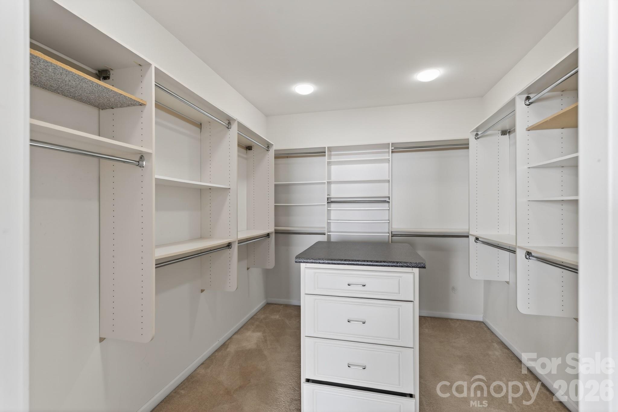 114 Inlet Point Drive Tega Cay, SC 29708 - Photo 22 of 40 a view of walk in closet with empty racks