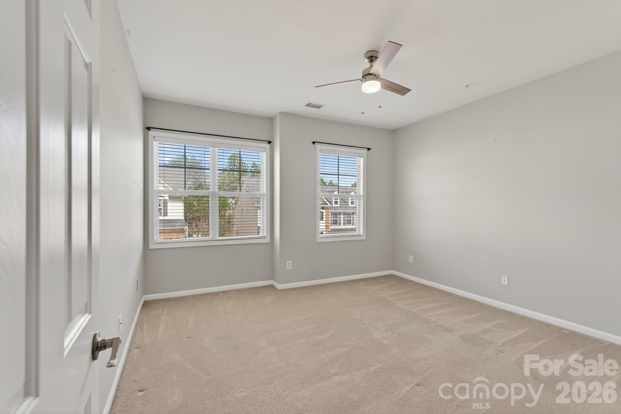 114 Inlet Point Drive Tega Cay, SC 29708 - Photo 25 of 40 wooden floor in an empty room with a window