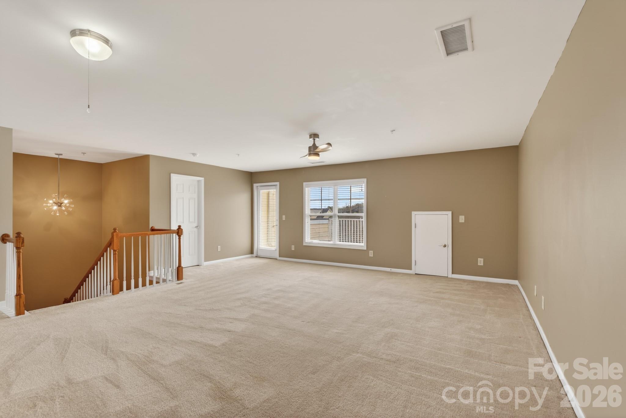114 Inlet Point Drive Tega Cay, SC 29708 - Photo 27 of 40 a view of a livingroom with a staircase