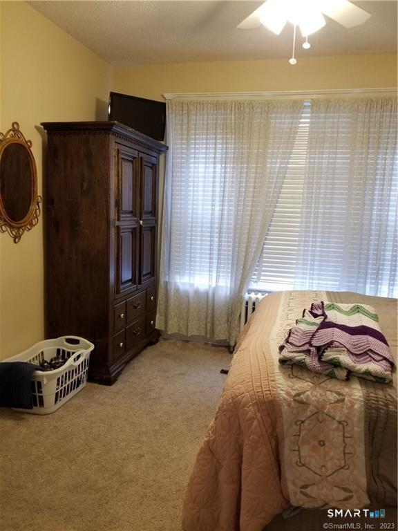 26 4th Street Hamden, CT 06514 - Photo 6 of 40 a bedroom with a bed and cabinets
