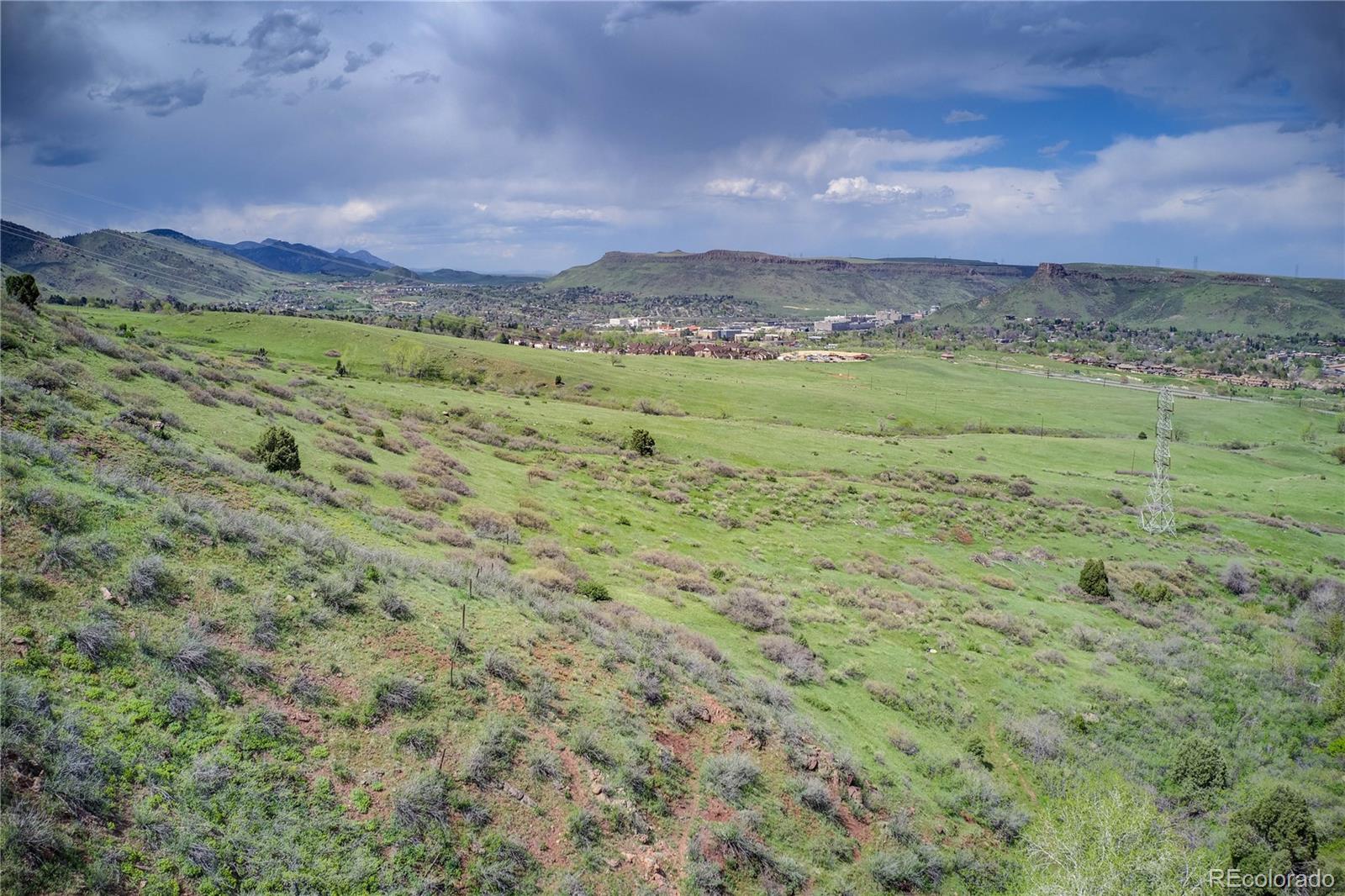 854 Shelton Road Golden, CO 80401 - Photo 24 of 31 a view of a field with a mountain in the background