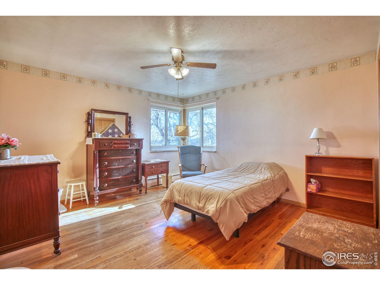 2148 North 75th Street Boulder, CO 80301 - Photo 11 of 41 a bedroom with a bed and a dresser