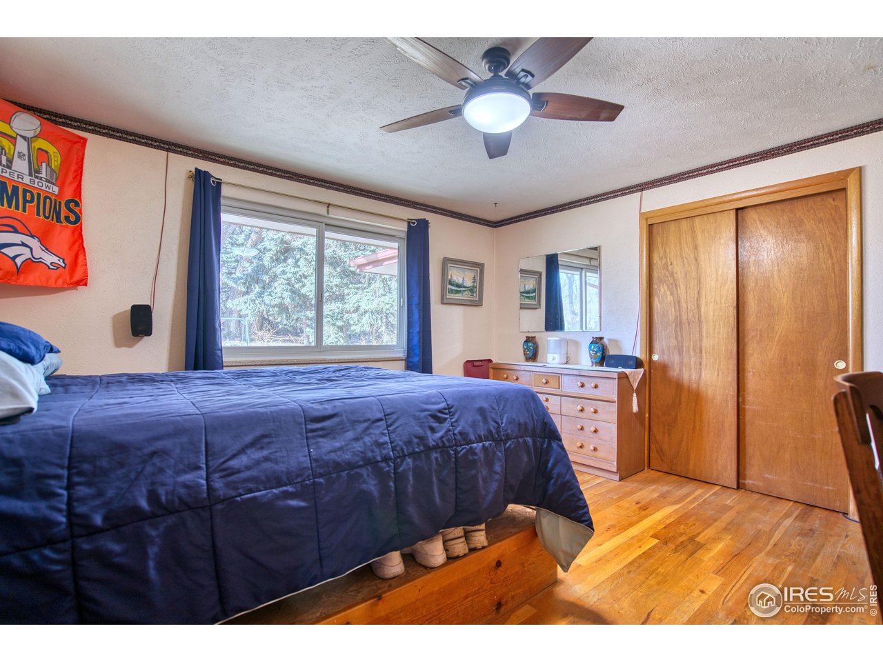 2148 North 75th Street Boulder, CO 80301 - Photo 14 of 41 a bedroom with a bed and a chandelier