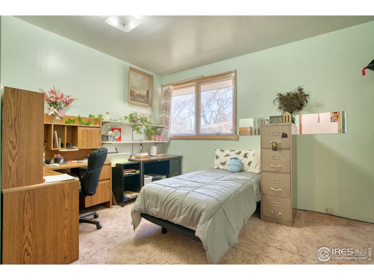 2148 North 75th Street Boulder, CO 80301 - Photo 15 of 41 a bedroom with a bed and a table