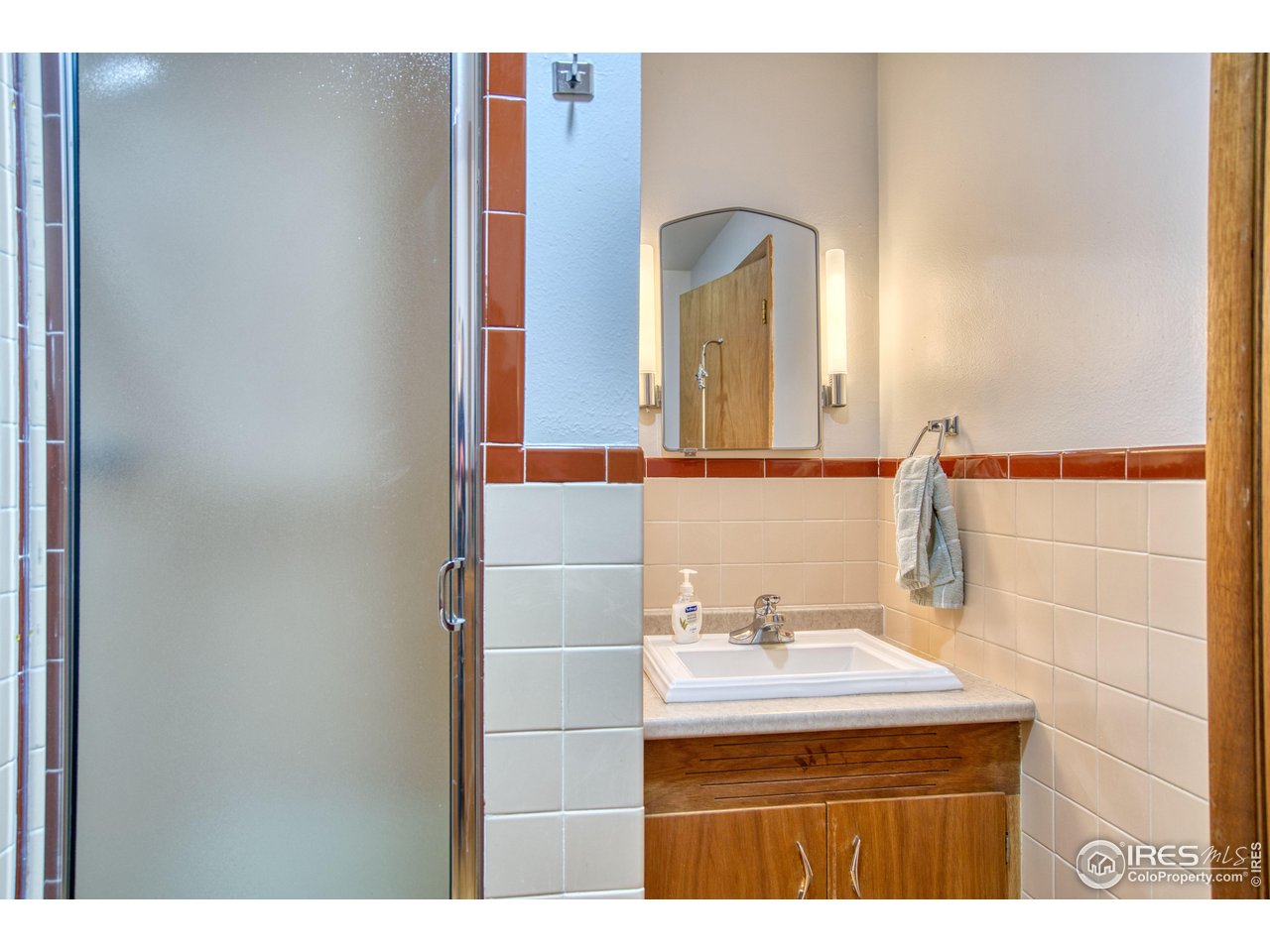 2148 North 75th Street Boulder, CO 80301 - Photo 17 of 41 a bathroom with a sink and a mirror