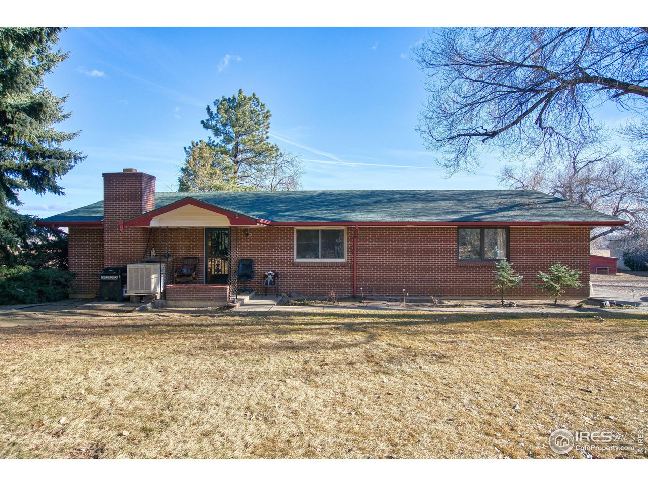2148 North 75th Street Boulder, CO 80301 - Photo 2 of 41 a backyard of a house with yard and outdoor seating
