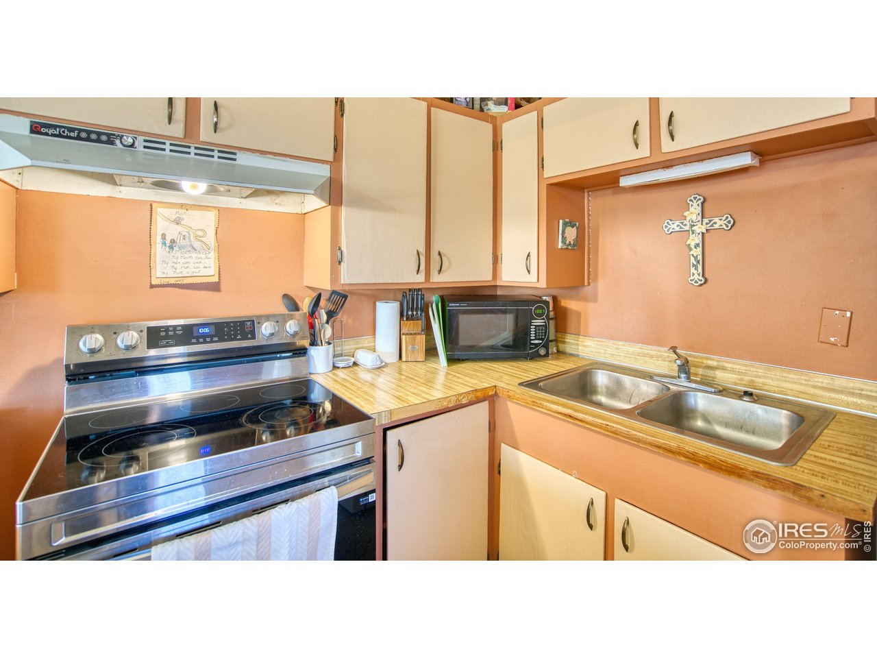 2148 North 75th Street Boulder, CO 80301 - Photo 22 of 41 a kitchen with a sink and a stove top oven