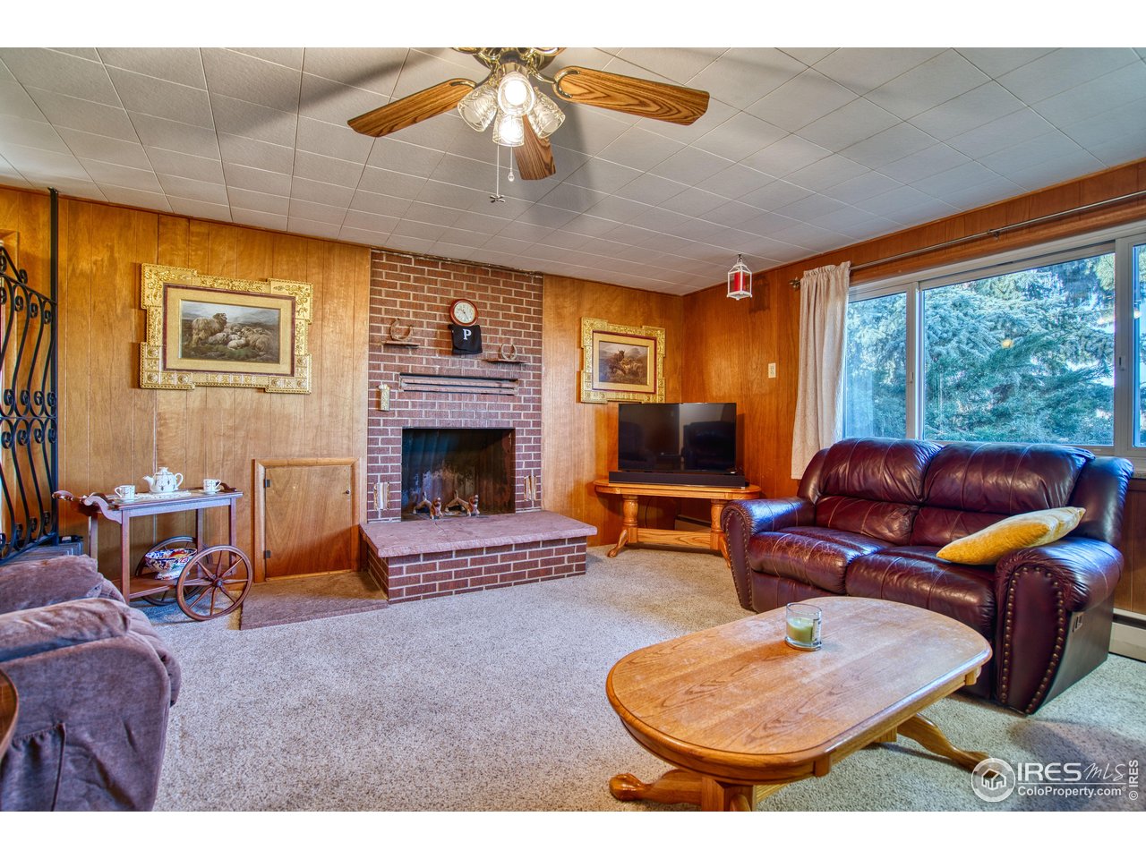 2148 North 75th Street Boulder, CO 80301 - Photo 3 of 41 a living room with furniture a fireplace and a flat screen tv