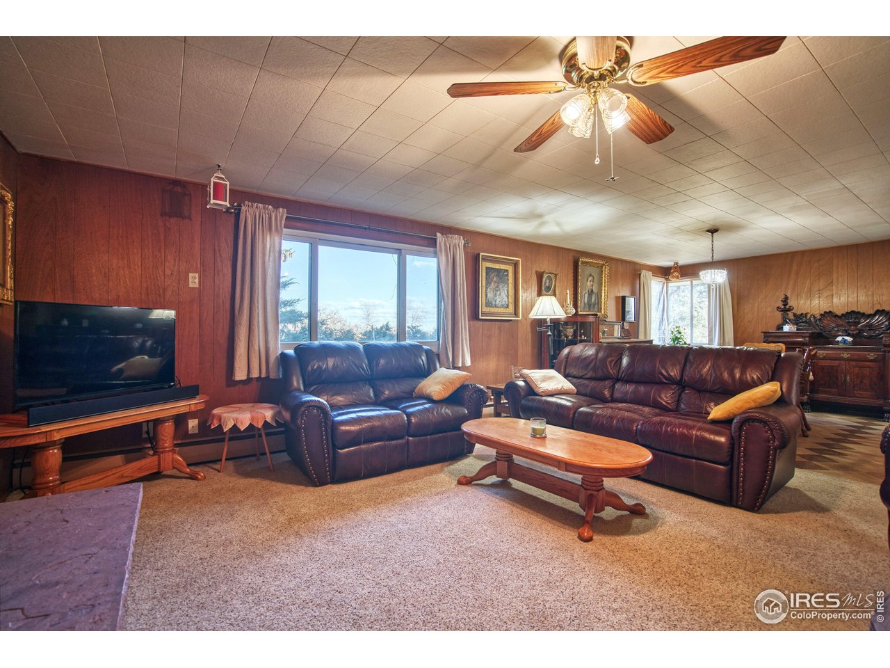 2148 North 75th Street Boulder, CO 80301 - Photo 5 of 41 a living room with furniture a flat screen tv and a window