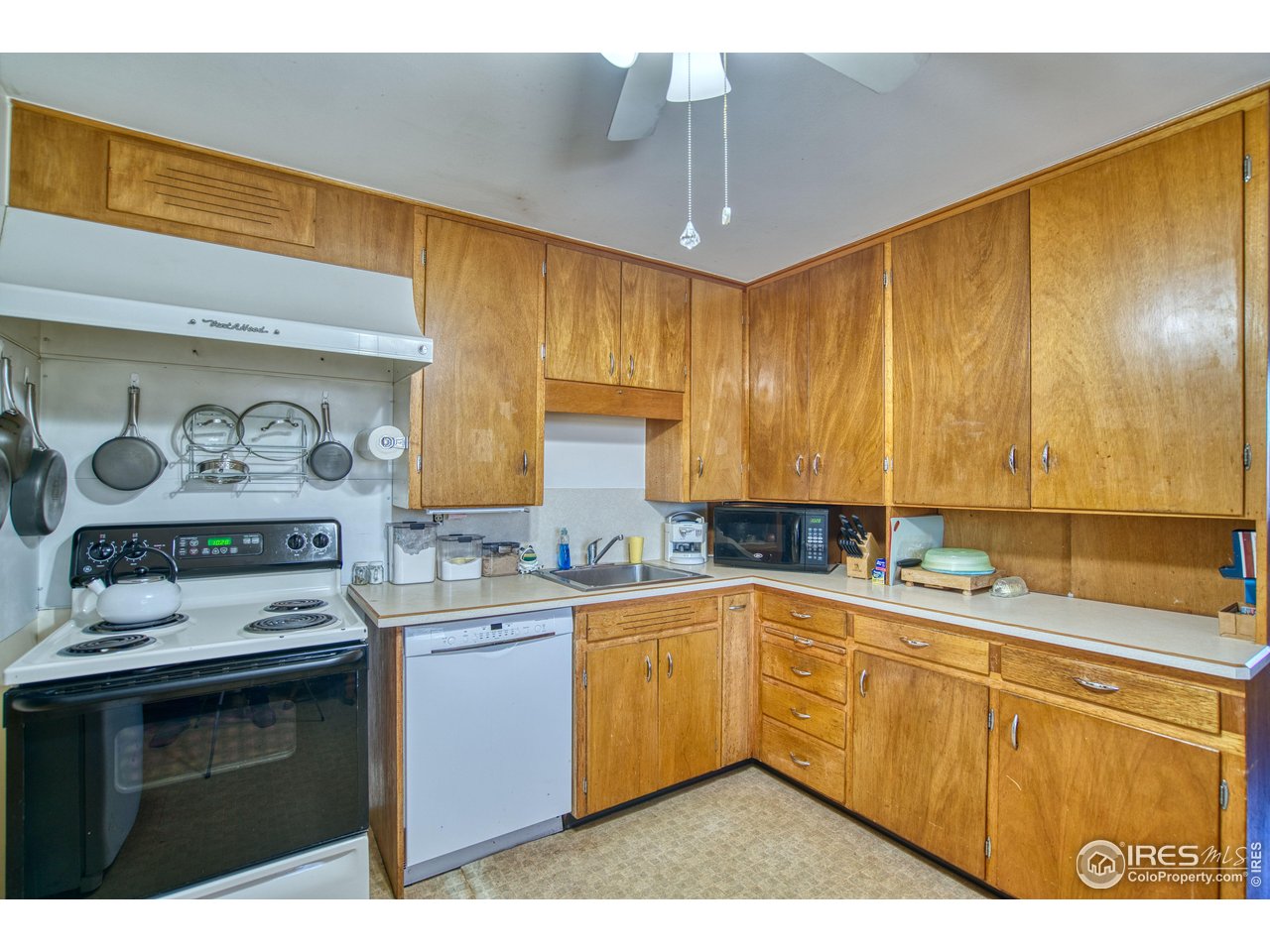 2148 North 75th Street Boulder, CO 80301 - Photo 9 of 41 a kitchen with a sink a stove cabinets and counter space