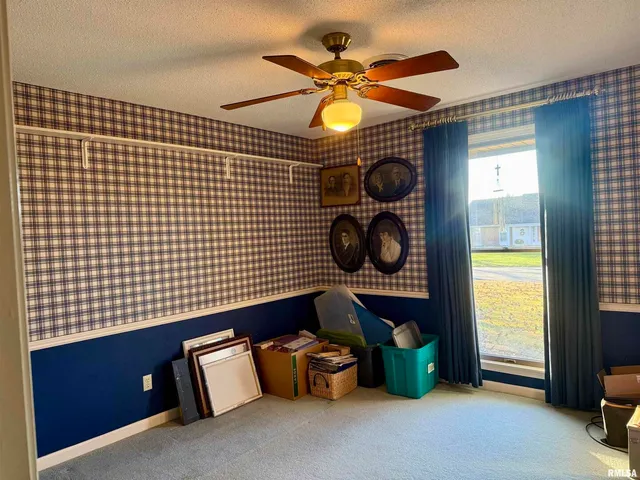 a room with lots of light fixtures and a window