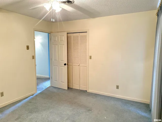 an empty room with a bathroom