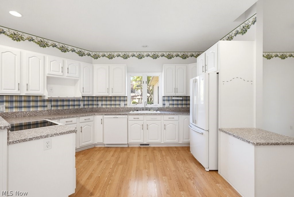 2331 Call Road Stow, OH 44224 - Photo 9 of 18 Spacious kitchen featuring abundant white cabinetry, generous counter space for meal preparation, and coordinating white appliances.