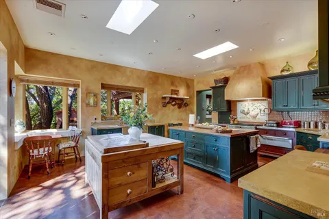 a kitchen with kitchen island granite countertop lots of counter top space