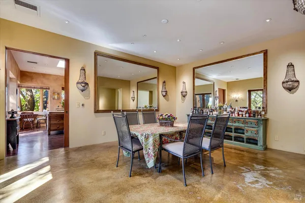 a kitchen with a table and chairs in it